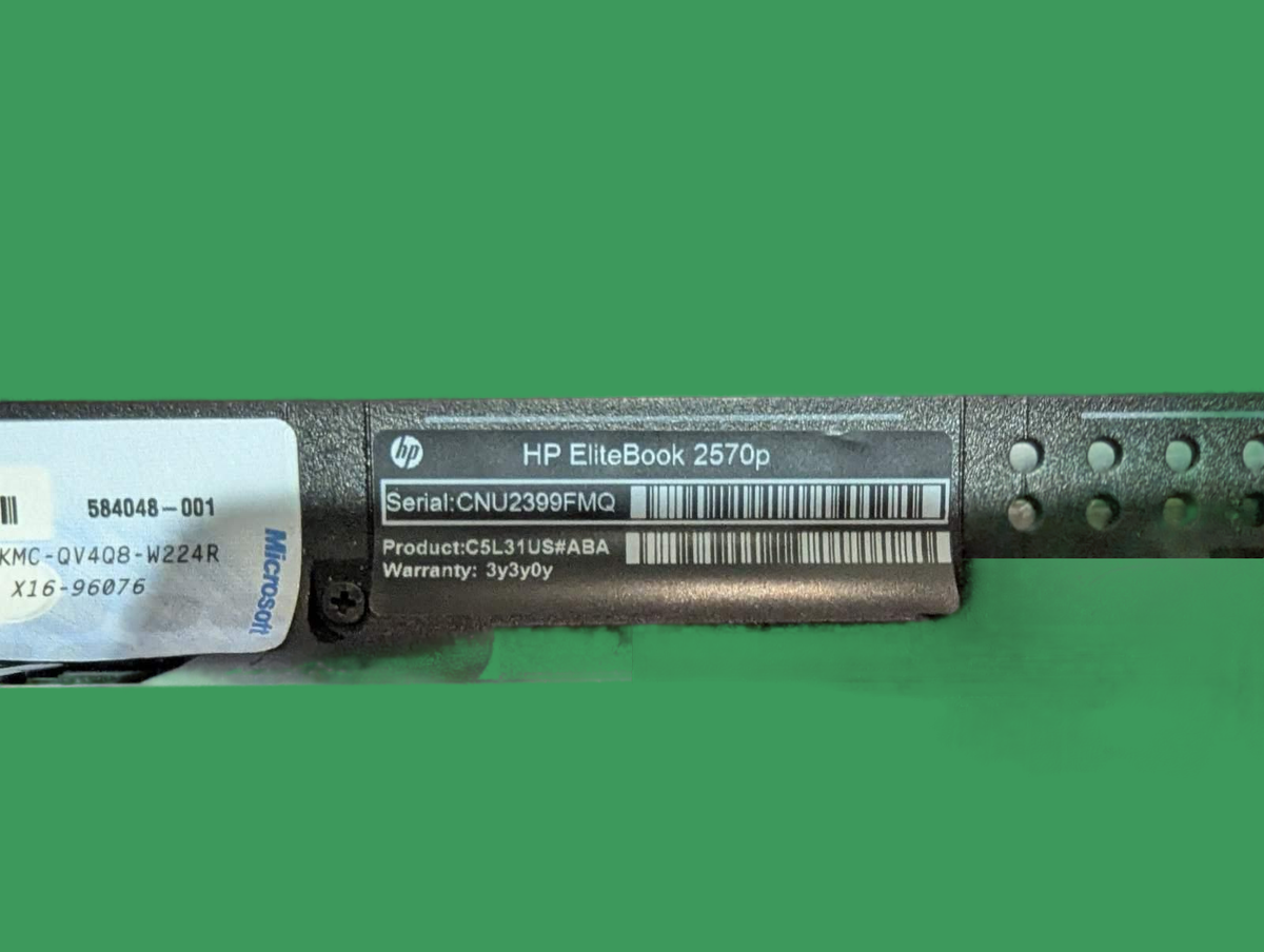Фото серійного номера та моделі ноутбука HP EliteBook 2570p, що включає серійний номер і гарантійні дані.